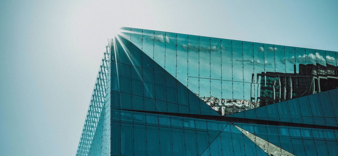 A glass building shining in the sun